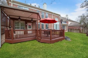 Backyard deck with BBQ grill at Austin vacation rental